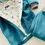 Miniaturbild: Dino-Walkjacke mit Hose für Babys, warmes Wollwalk-Set in Petrol, mitwachsend und handmade in Hamburg – Küstenfieber®.