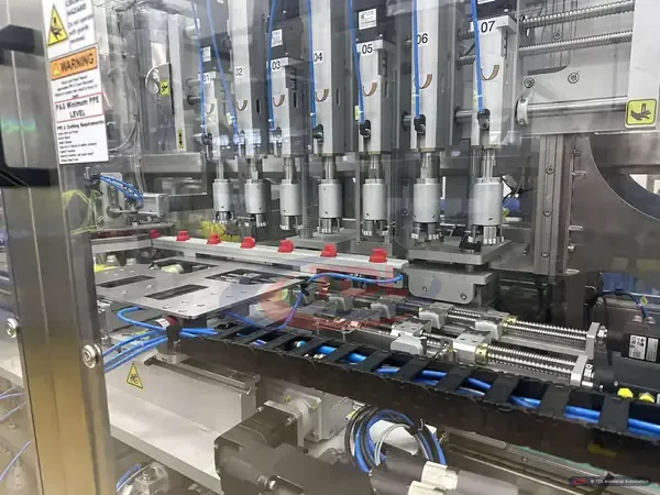 Capping heads and linear axes of a 2-lane servo capper automated by TDL