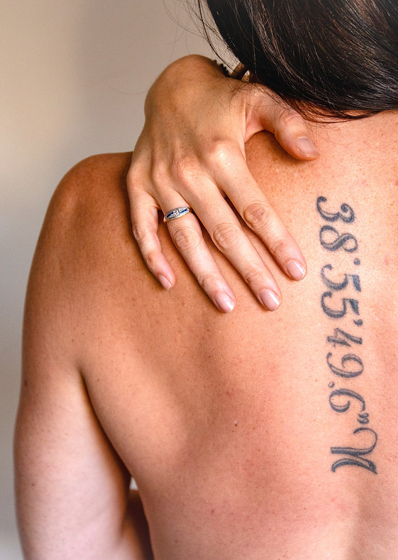 Ruth Ramsay, Adult Sex Educator and Coach, topless and showing her latitude spine tattoo