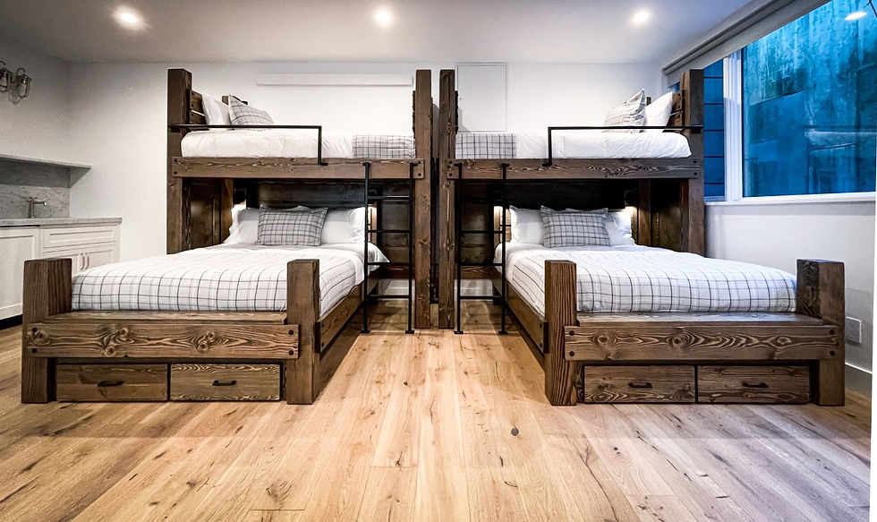 Four-bed freestanding bunk with integrated lighting and custom wood finish