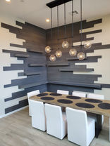 Black Custom design accent wall in corner of dining room, Thermory, poplar wood, custom stain