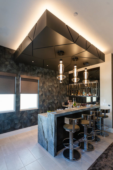 Custom bar with floating ceiling and lighting, waterfall edge counters