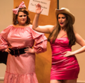 OperaWorks performers in colorful costumes during staged opera production