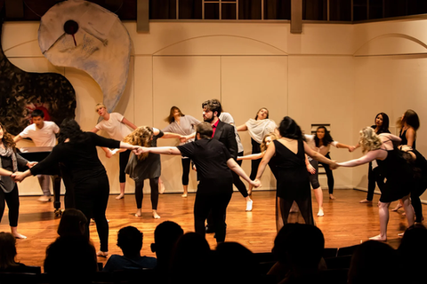 OperaWorks singers in movement-based ensemble performance on stage