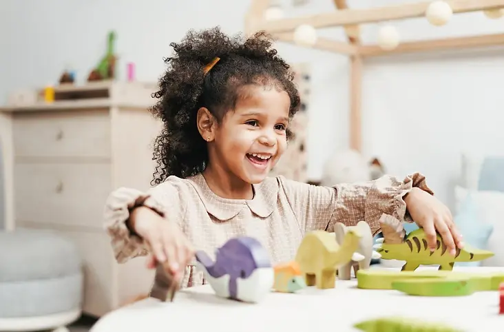 a child smiling widely.webp