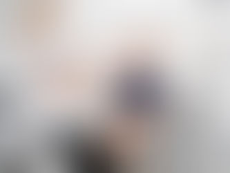 A pediatric dentist and a child patient celebrate with a high five after a dental visit.