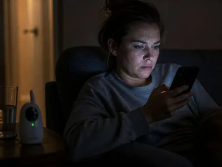 Worried parent researching tongue tie myths on phone