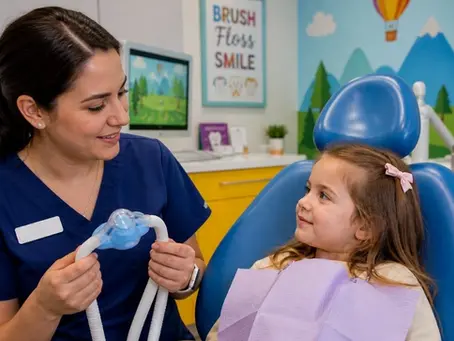 Child sitting calmly in pediatric dental chair before sedation dentistry appointment