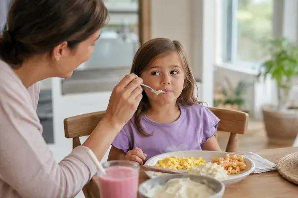 girl eating soft foods