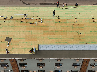 Dry in. Ice and water being installed. Synthetic felt underlayment being rolled out. Waterproofing roof. Commercial roofing contractors. Bozeman Montana