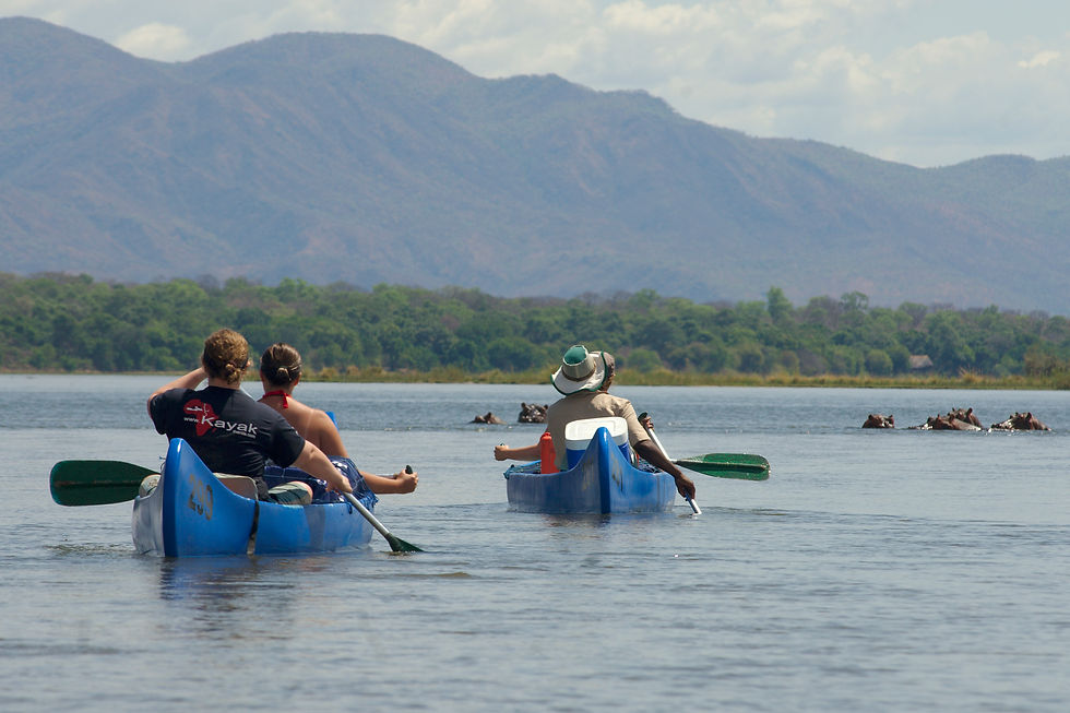 Eye-level view of a guide instructing participants on safe canoeing techniques