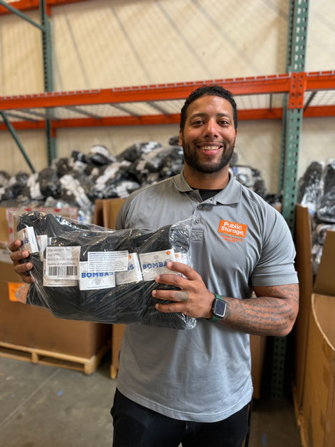 Volunteer holding sock donations