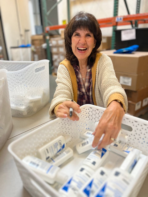 Volunteer sorting donations