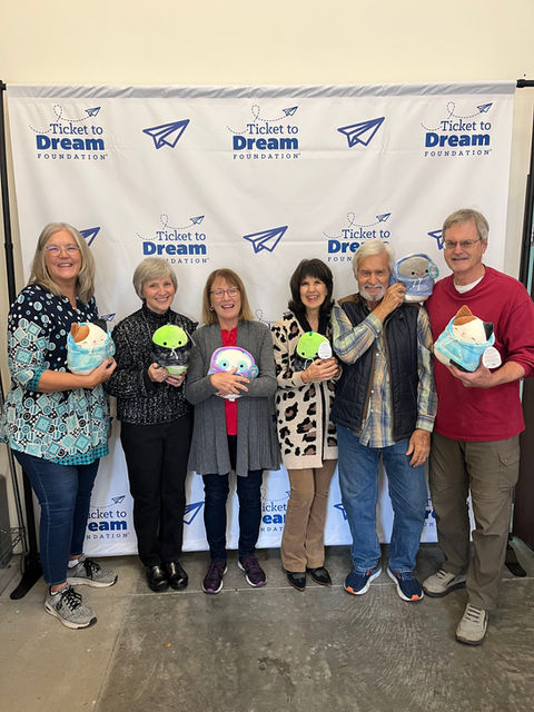 Volunteers holding toy donations