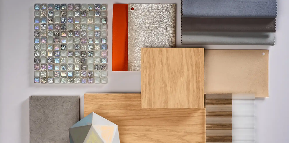 Mosaic tiles, fabric swatches in gray, silver, orange, wood textures, and a geometric shape on a light background, displaying materials.