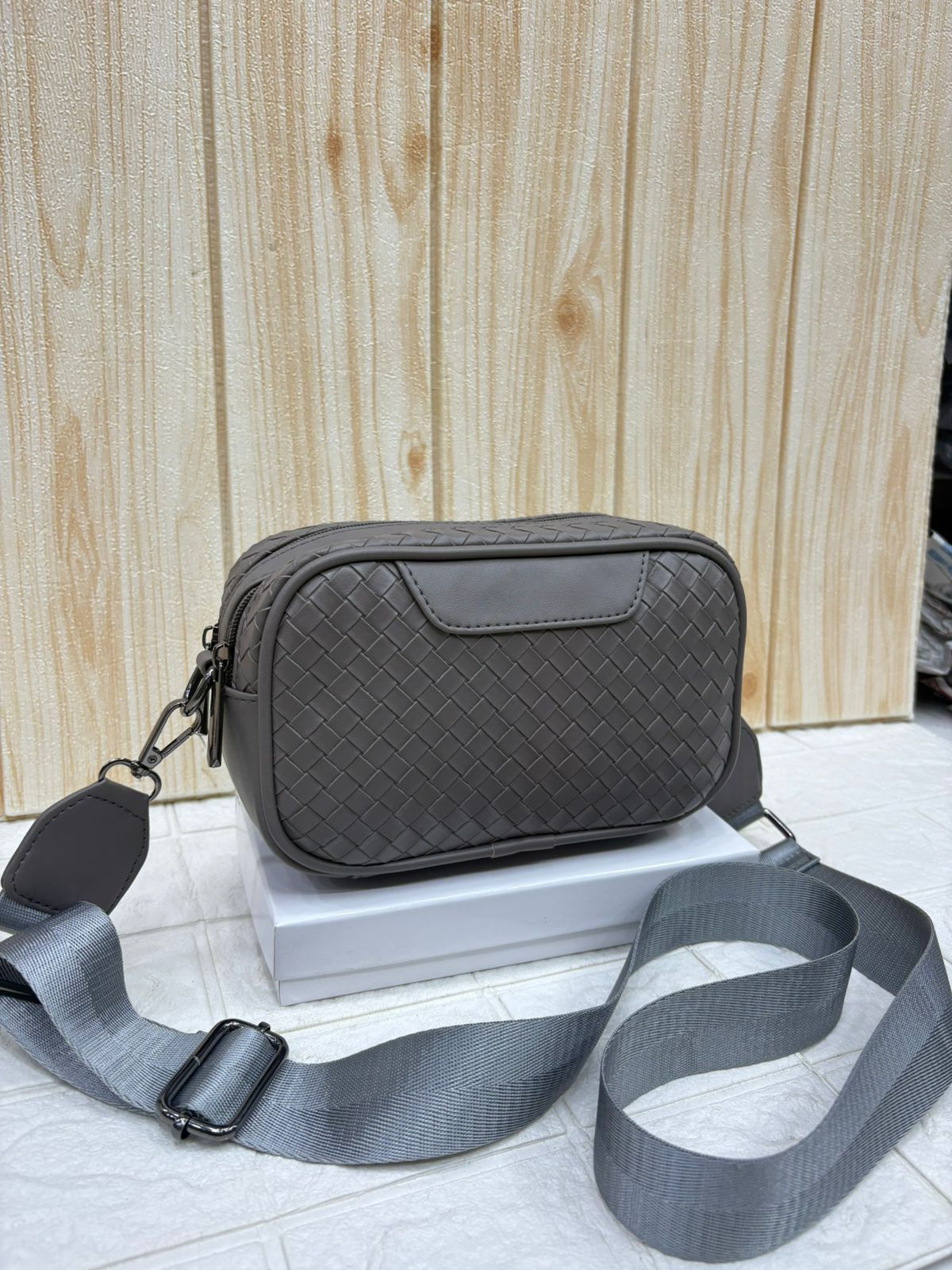 Bottega Sling Bags in Paesto