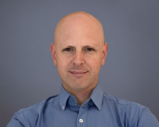 Upward look at plam trees with sun.