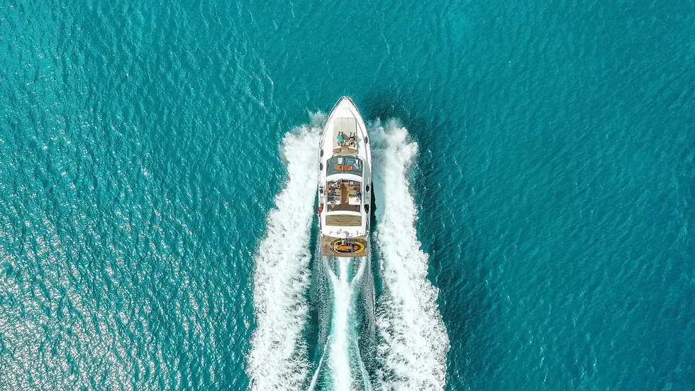 Aerial view of luxury yacht near Annara Residences, showcasing the coastal elegance of a luxury home Phuket