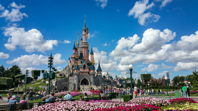 a castle with a lot of people around it