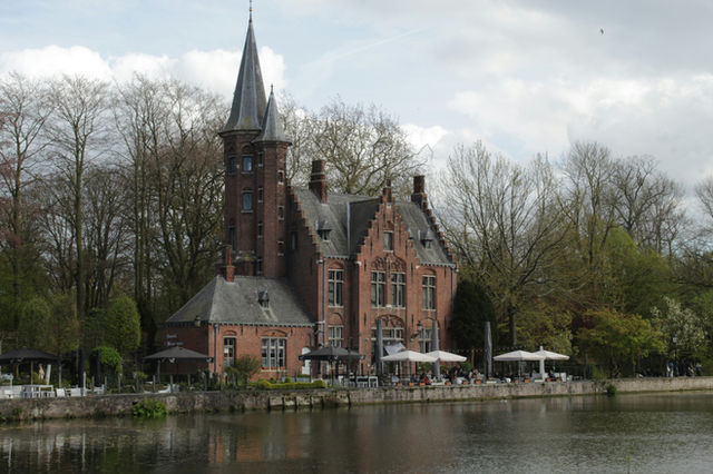 Historic brick house beside the water in Bruges, Belgium.