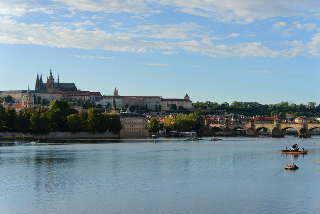Prague castle and charles bridge over vltava river.
