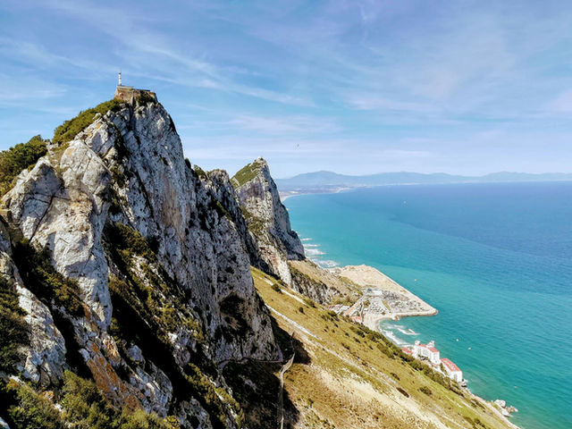 mountain near body of water during daytime