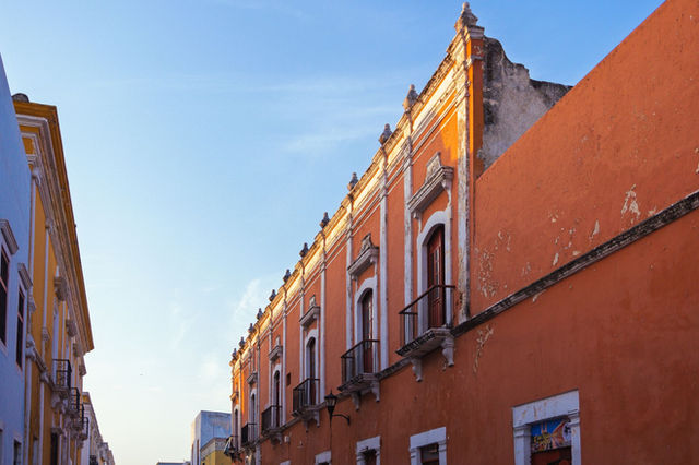 Stunning view of colorful colonial buildings in San Francisco de Campeche under clear blue skies.