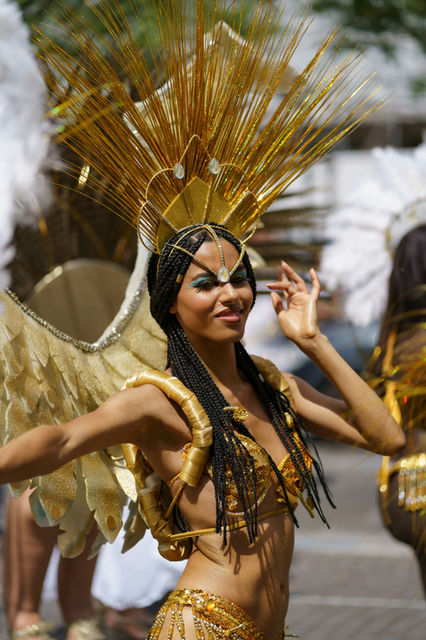 Gold and silver, metallic against a summer sky — the Paris tropical carnival