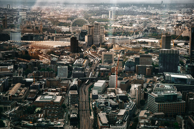 Stunning aerial view of London's bustling cityscape featuring iconic landmarks and urban architecture.