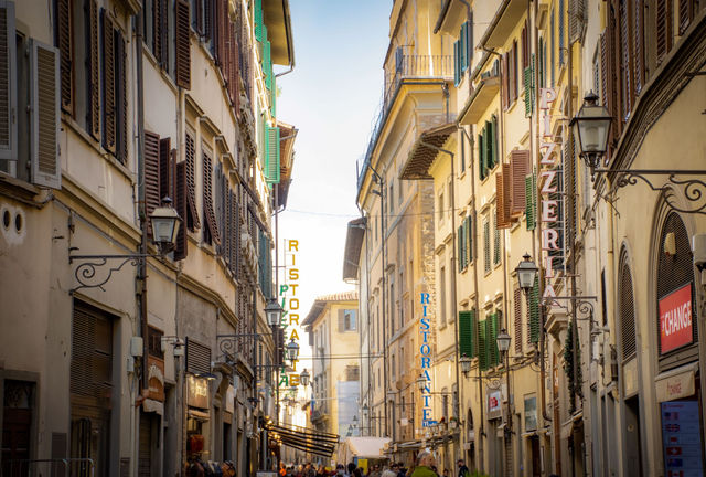 Scenic street view in Florence, Italy showcasing architecture and bustling life.