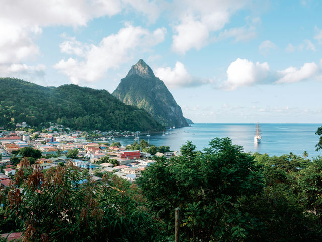 a view of a small town and a mountain in the distance