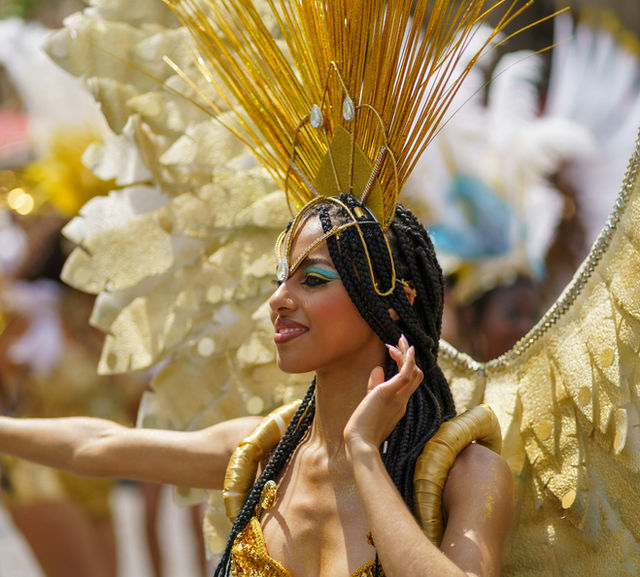 Wings spread the width of the street — the Paris tropical carnival