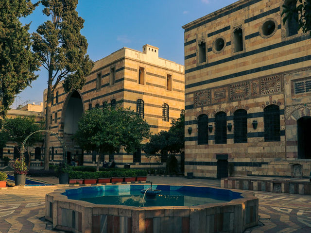 Beautiful historic courtyard with traditional architecture in Damascus, Syria.