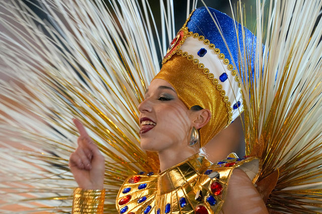 An Egyptian-themed costume, gold pleats and a winged collar