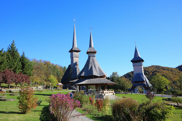 A large building with three spires on top of it