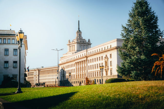 Large government building with a lawn in front