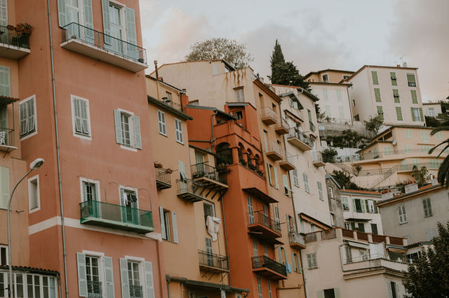 Colorful buildings in Menton, France showcasing unique French architecture.