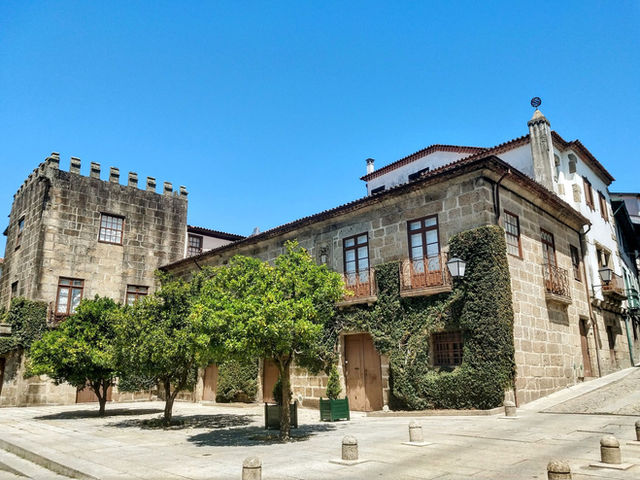 Explore medieval architecture in Guimarães, Portugal on a sunny day.