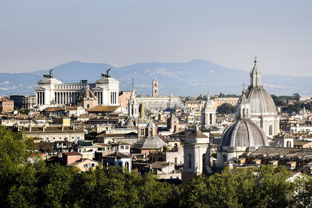 Beautiful panoramic view of Rome featuring historic domes and landmarks.