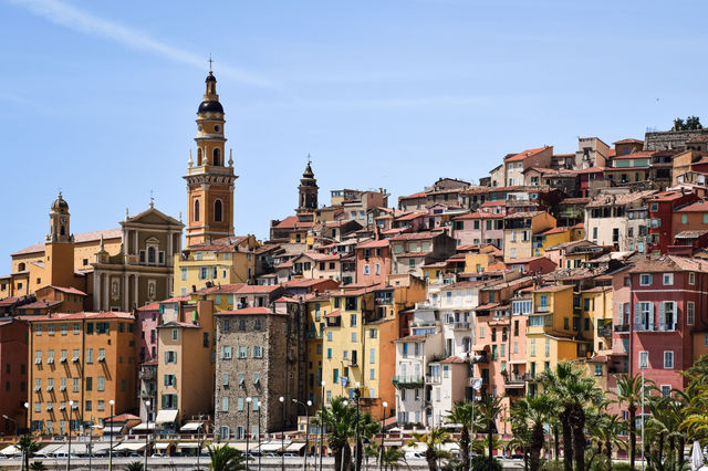Vibrant hillside buildings in Menton, showcasing iconic French Riviera architecture.
