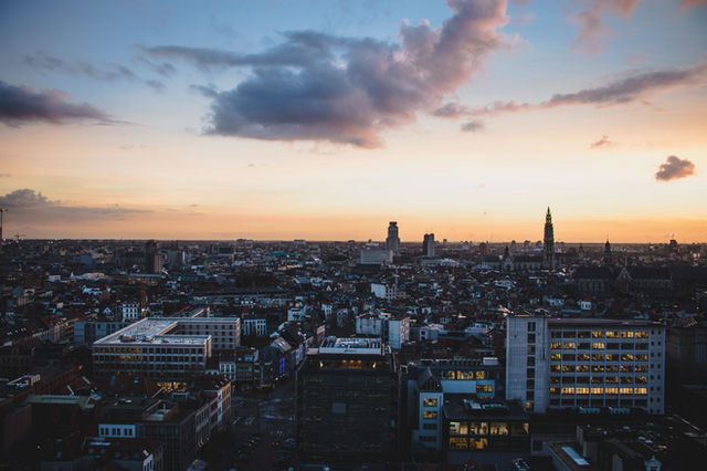 A stunning aerial view of Antwerp, Belgium, cityscape at dusk with vibrant sky colors.