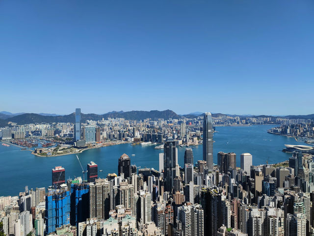 The iconic view of Hong Kong, taken from Victoria Peak on Hong Kong Island and facing Kowloon Peninsula in the background. The sea in between is Victoria Harbour.