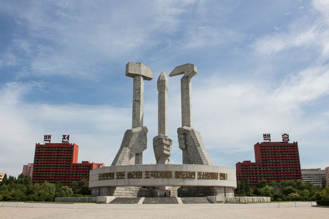 white concrete monument under blue sky during daytime