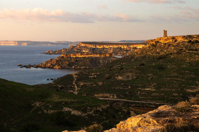 A view of the ocean from the top of a hill