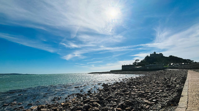 Stone causeway leading to a castle by the sea
