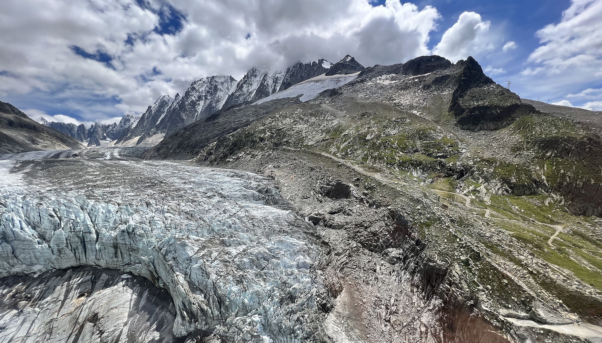 Blue glacier ice tumbling toward the valley below the Mont Blanc massif, Chamonix