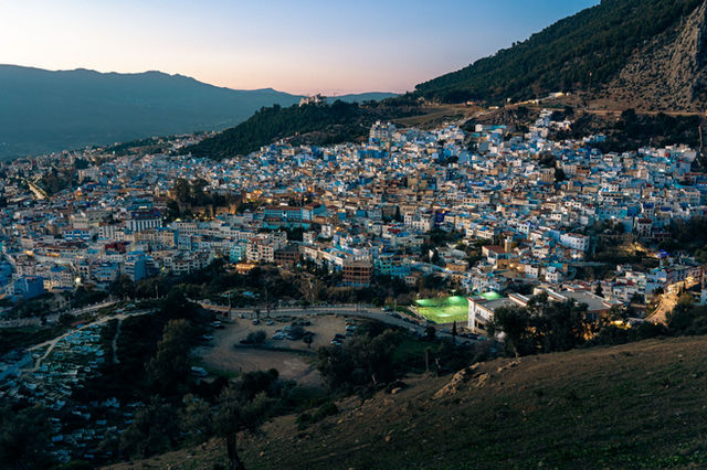 Captivating twilight view of Chefchaouen, the blue city in Morocco, nestled among the Rif Mountains.