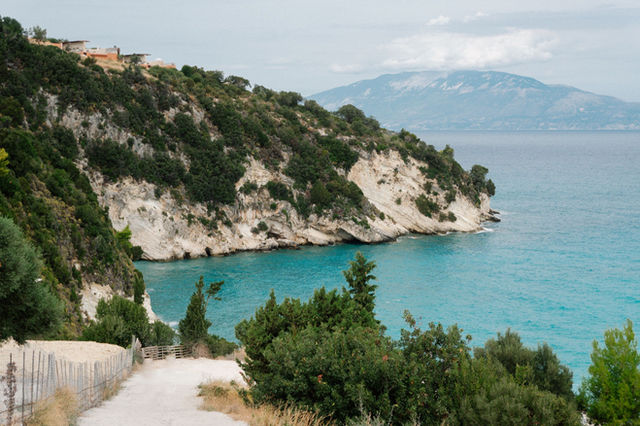 Breathtaking coastal landscape of Zakynthos, Greece with turquoise waters and lush greenery.