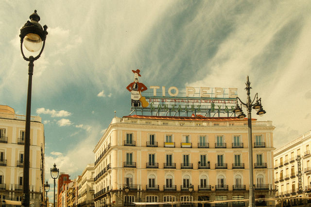 Vintage view of tio pepe building in a city square.