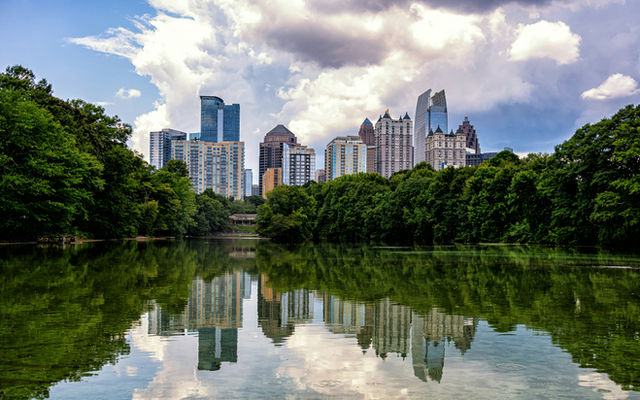 A view of the Atlanta, Georgia skyline as seen from the shores of Lake Clara Meer in Piedmont Park.